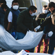 Forensic examiners removing bodies after a gas explosion in Hidalgo state, Mexico, on Jan. 19, 2018.